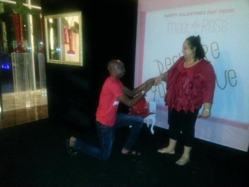 Man proposing to woman on Valentine's Day.