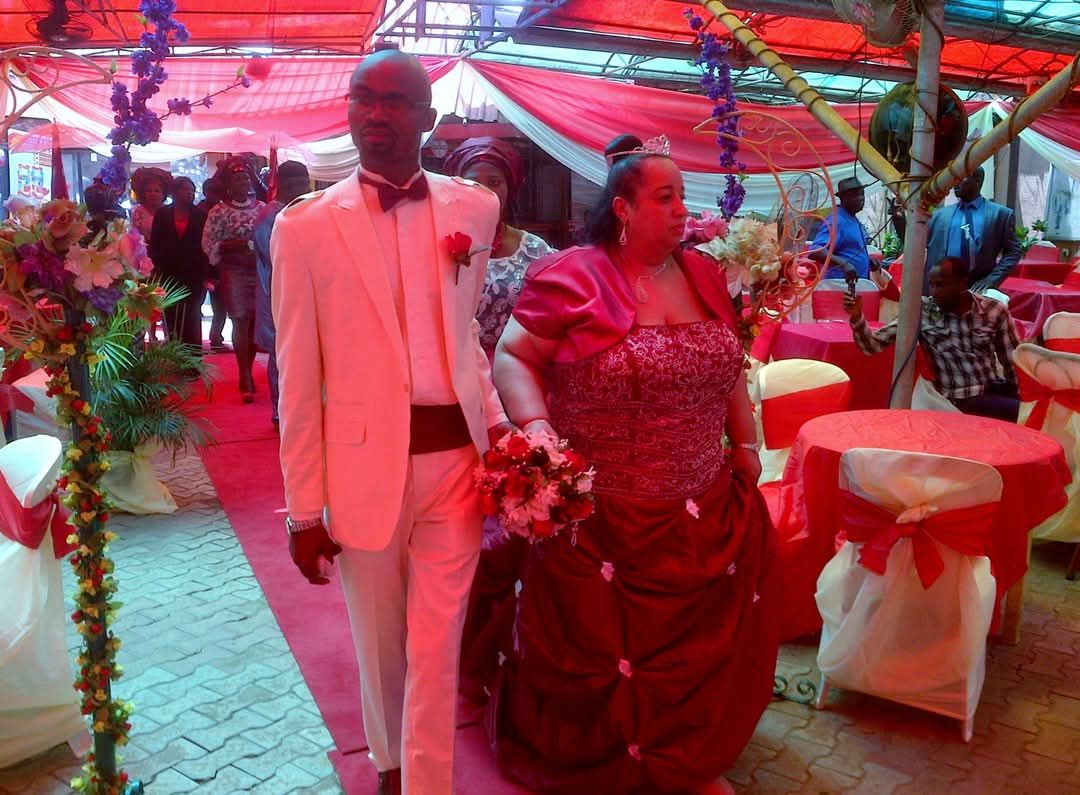 Couple walking at a decorated event.