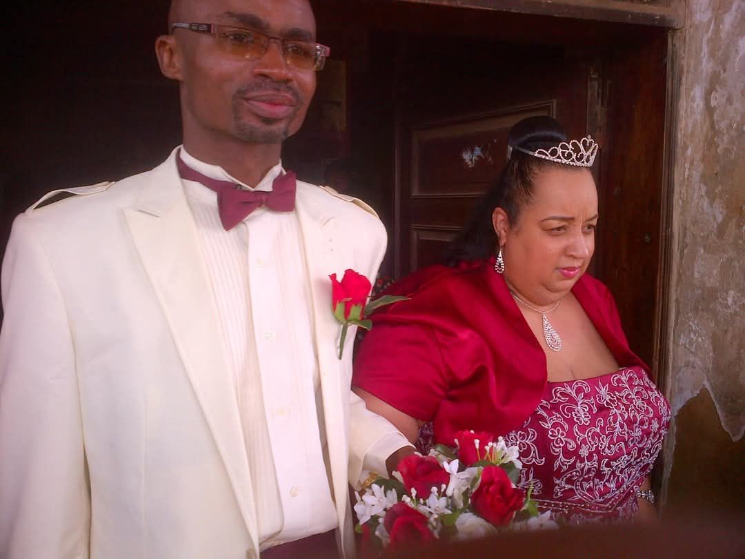 Couple dressed for a wedding ceremony.