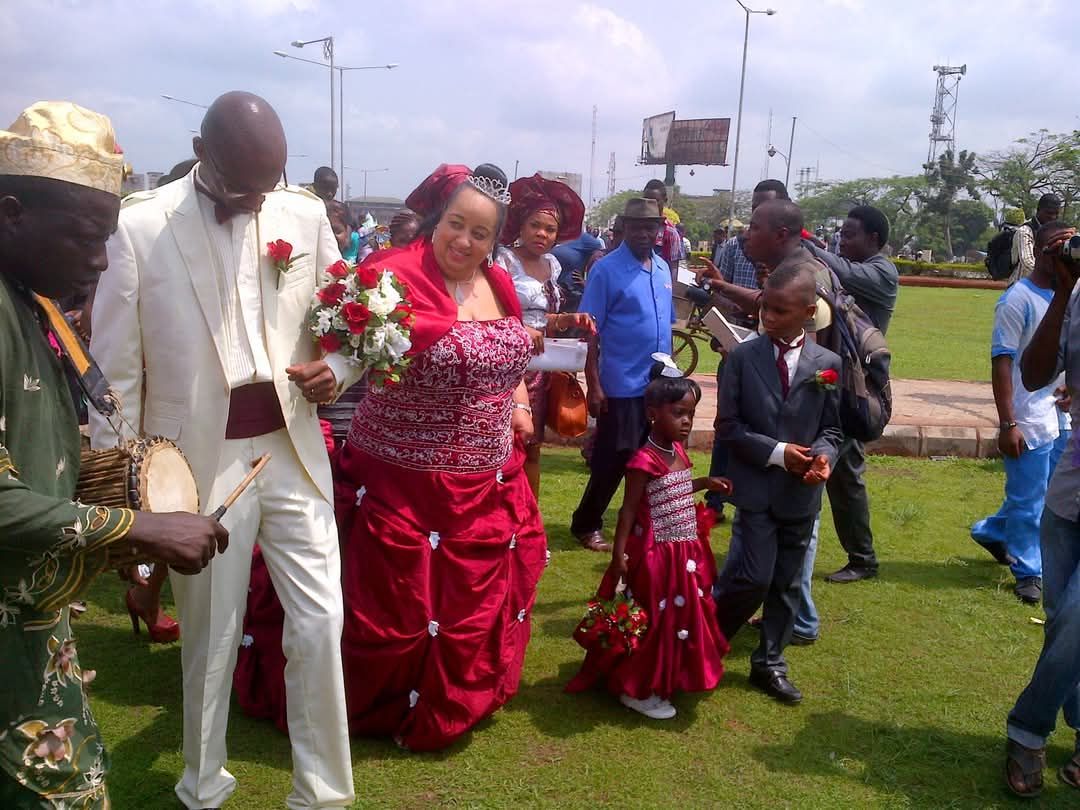 Bride and groom in wedding celebration outdoors.