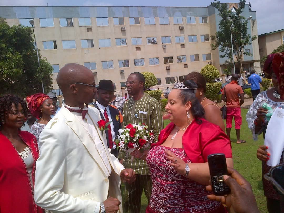 Wedding celebration with guests in vibrant attire.